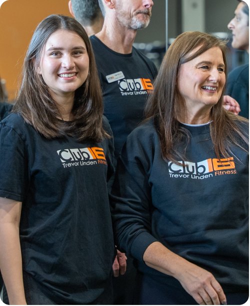 Three Club16 team members laughing together in the club