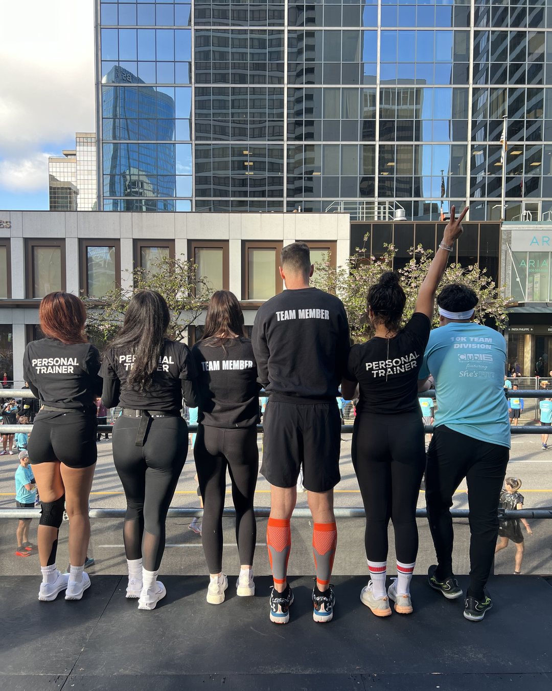 Club16 personal trainers and team members at the barrier watching the course
