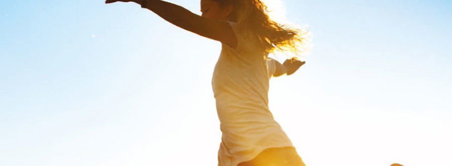 Photo of lady dancing in sunshine - exercise