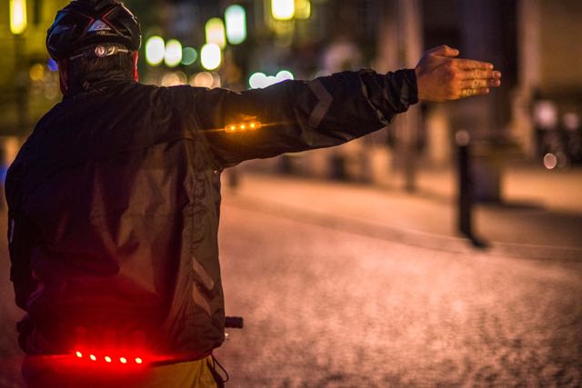 Biker with LED lights for signaling and visibility 