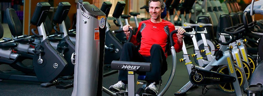 Trevor working out on chest press machine