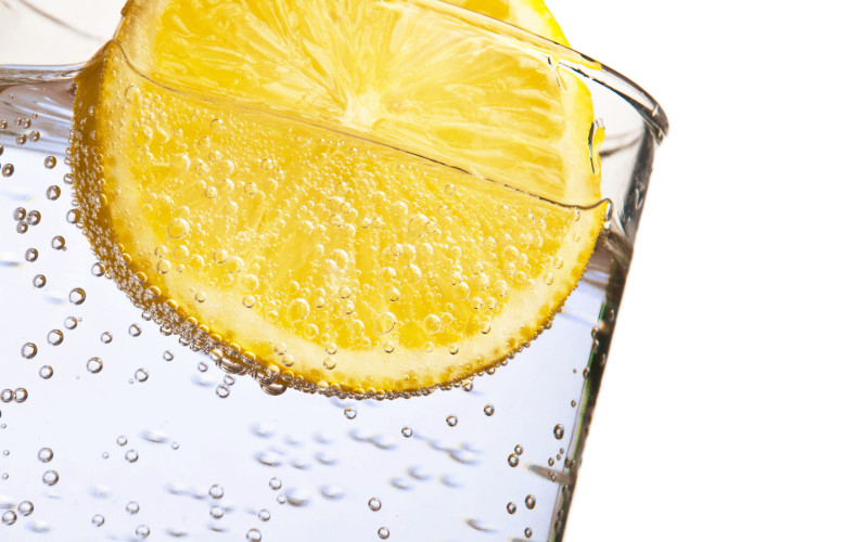 Lemon Drink Soda water with lemon isolated on white